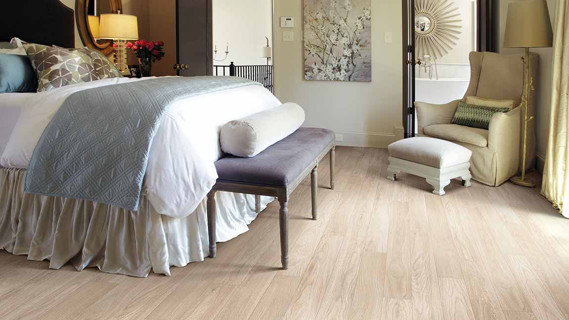 Laminate flooring in a bedroom, installation services available.