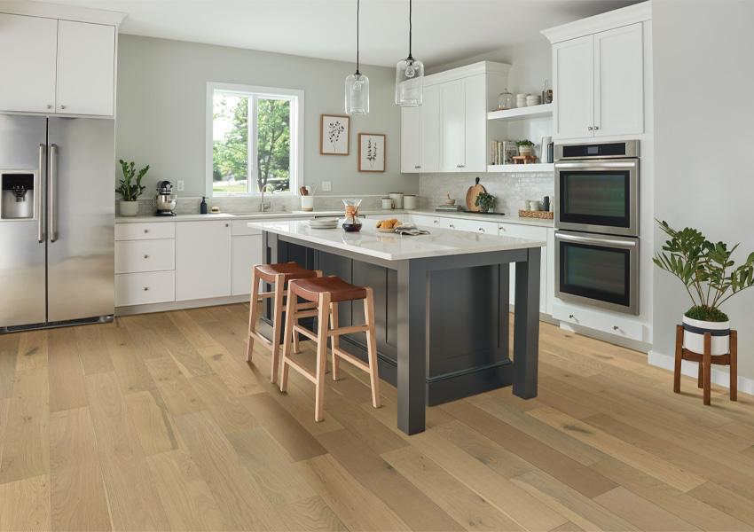 engineered hardwood flooring in kitchen with grey kitchen island.